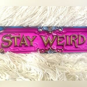 Pink and Gold 'Stay Weird' metal sign